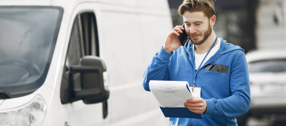 man-by-truck-guy-delivery-uniform-man-with-clipboard-scaled.jpg